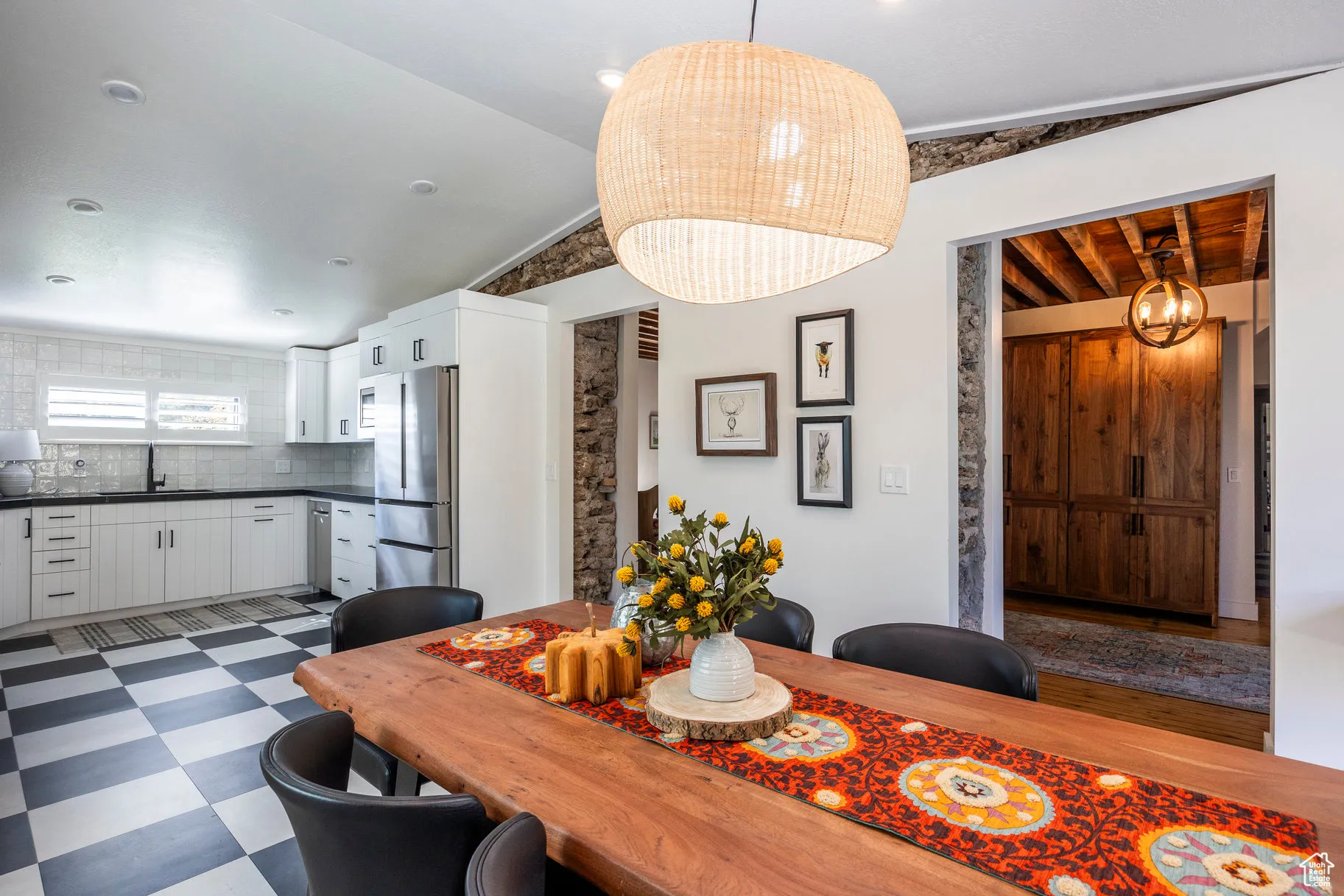Dining space with dark flooring
