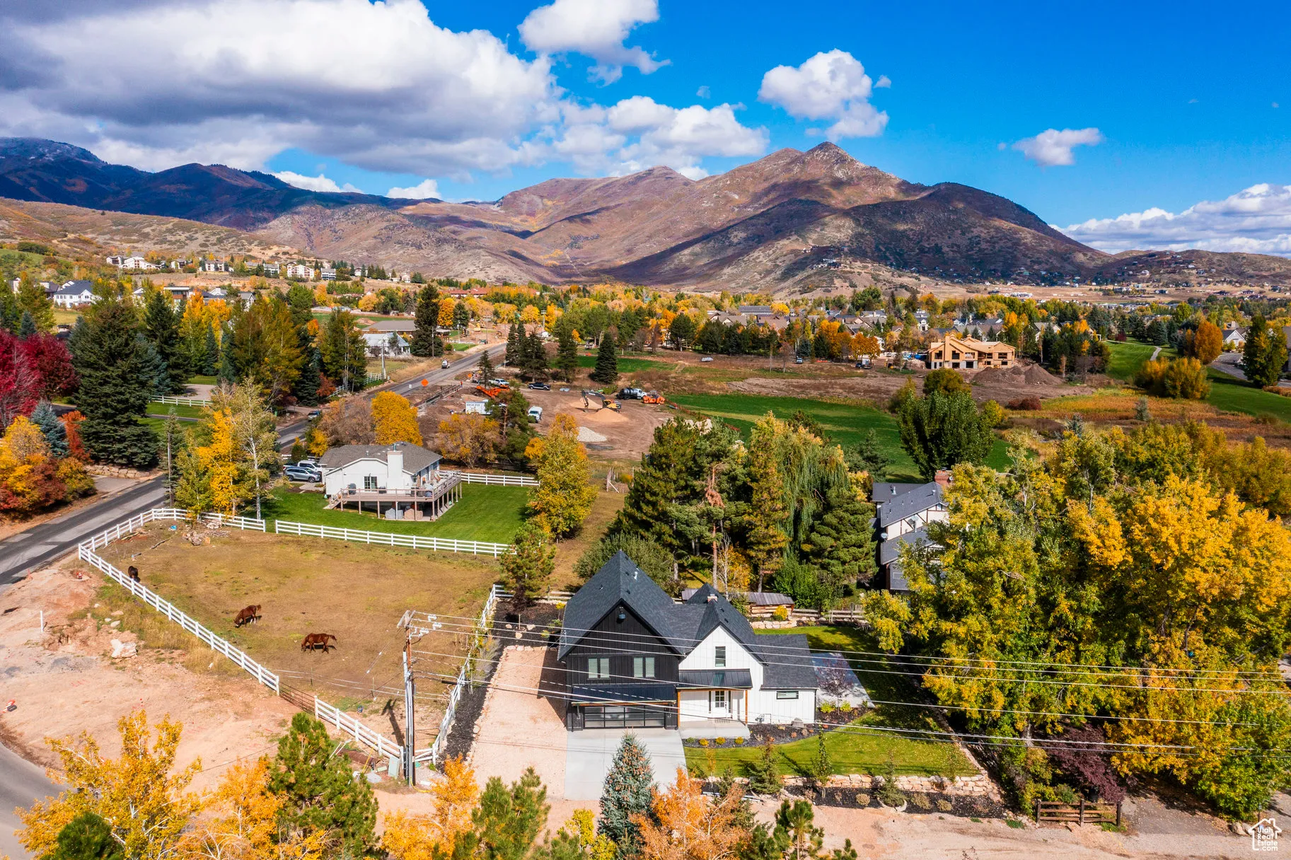 View from above of property with a mountain backdrop