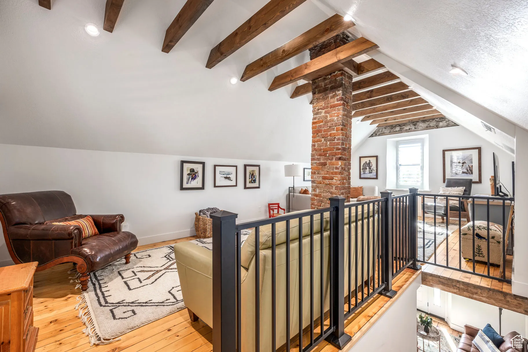 Living area featuring light wood-style floors and baseboards