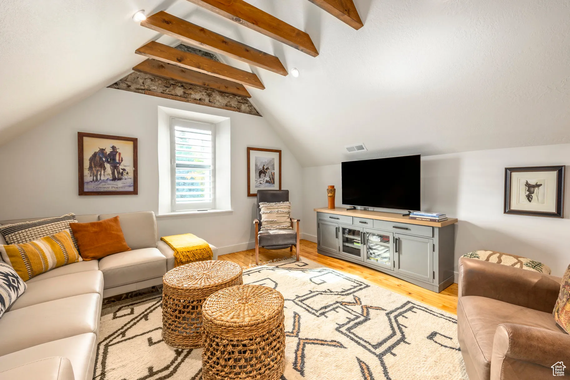 Living area featuring light wood-type flooring and baseboards