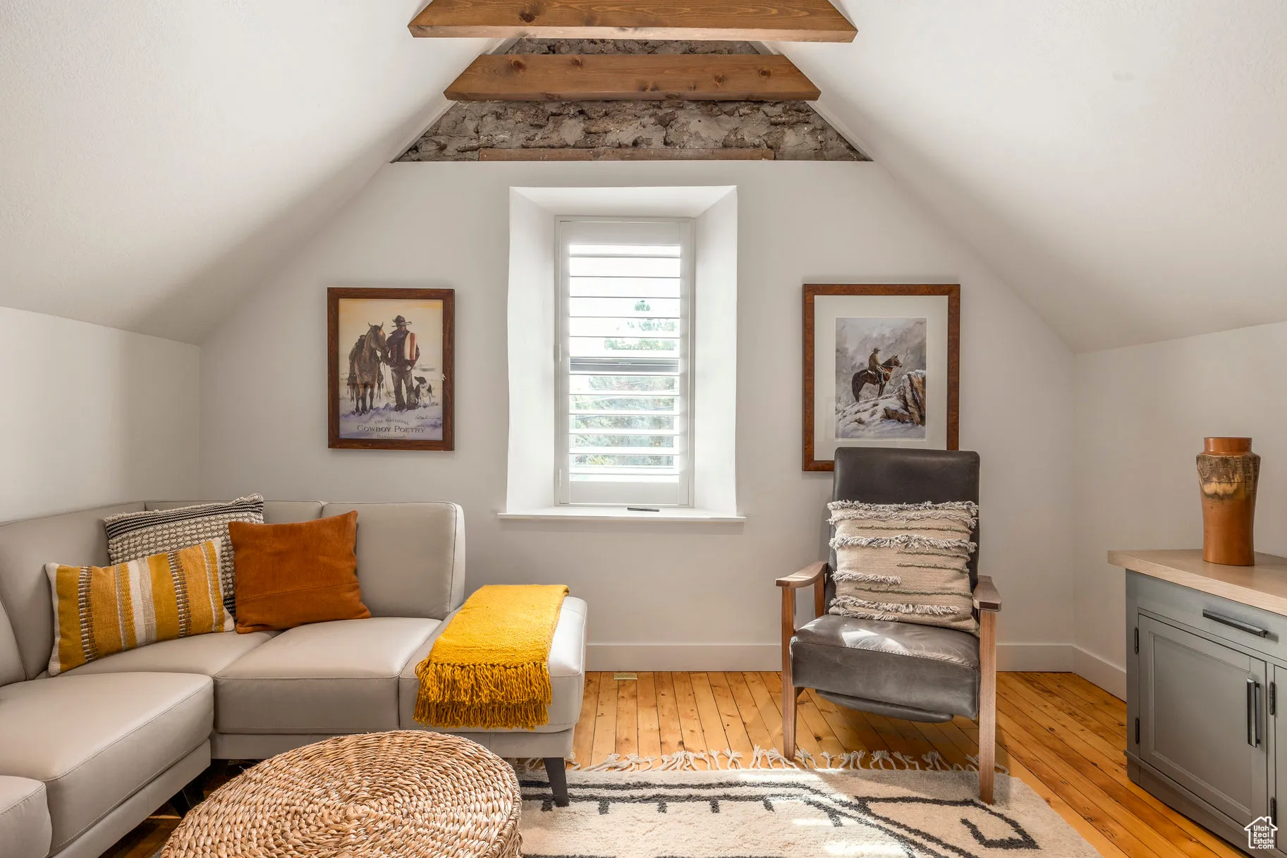 Sitting room featuring light wood-style flooring and baseboards
