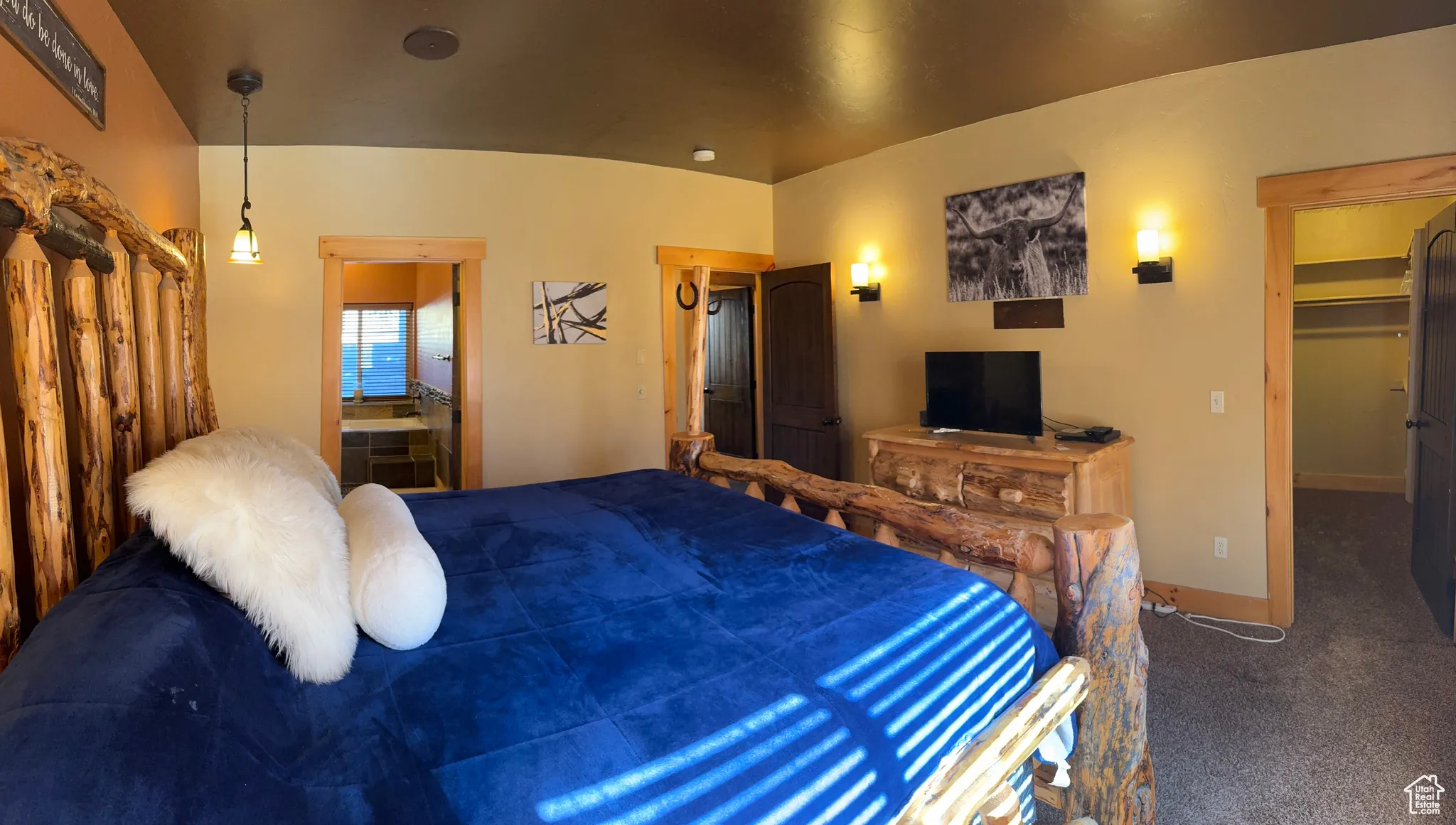 Bedroom featuring carpet floors and a spacious closet