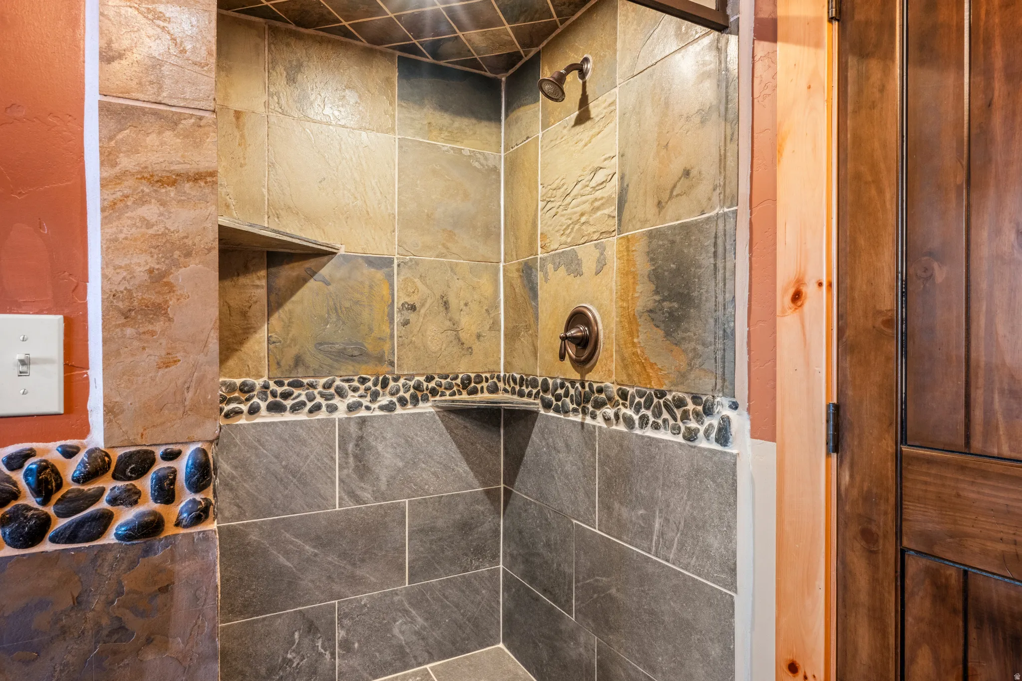 Bathroom view of a tile shower