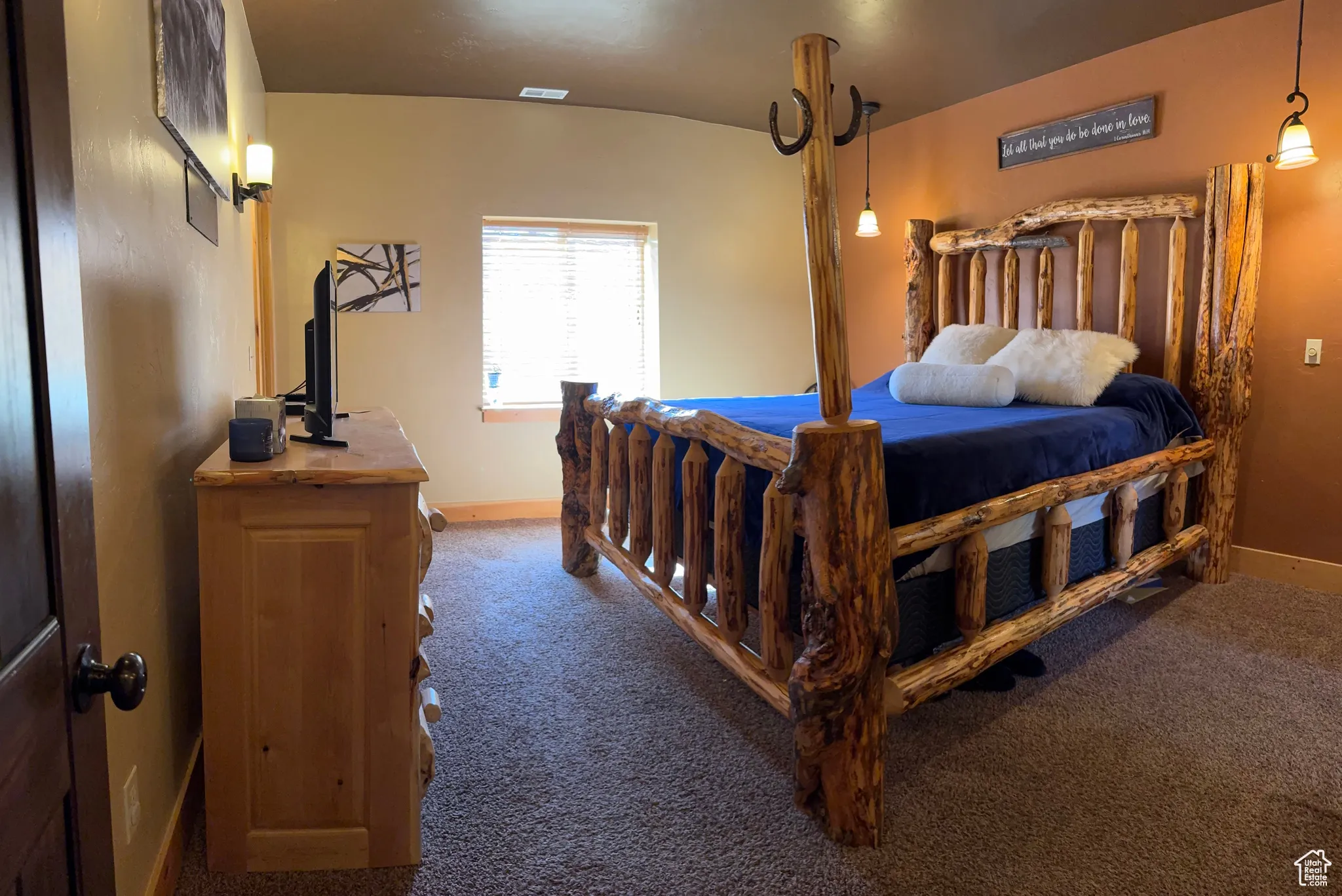 Bedroom with baseboards and dark carpet