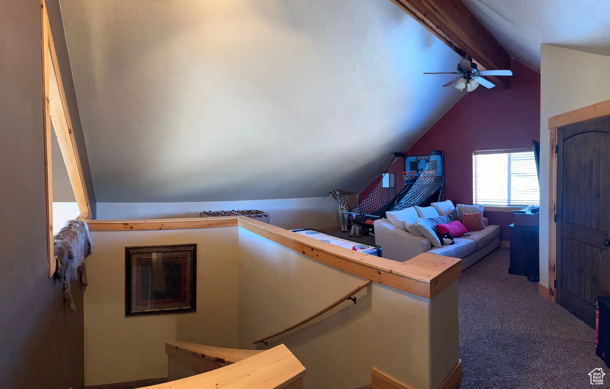 Staircase featuring carpet and ceiling fan