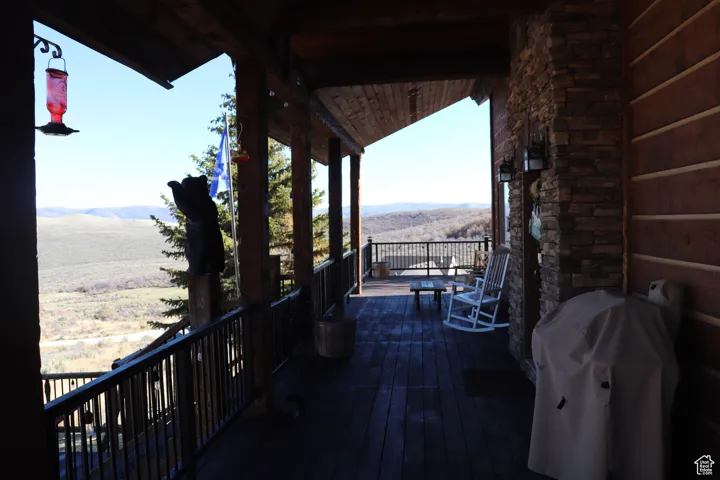 View of patio featuring a mountain view and grilling area