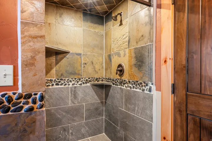 Bathroom view of a tile shower