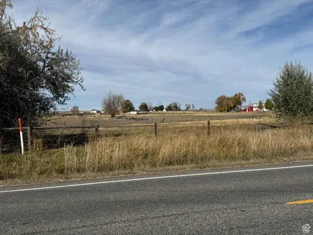 View of asphalt road with a rural view
