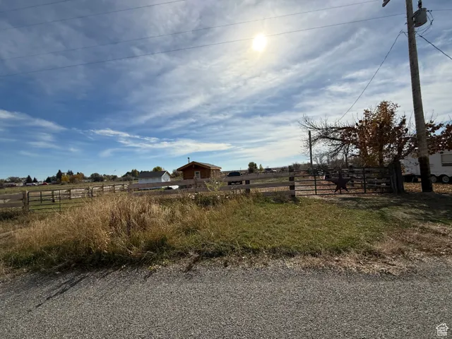View of yard with a rural view