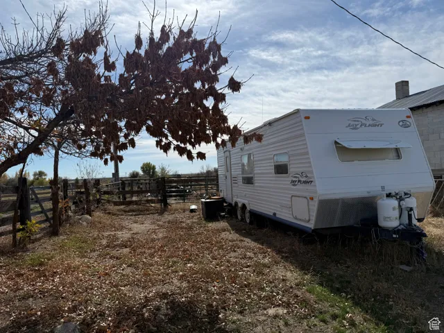 View of side of home with a cooling unit
