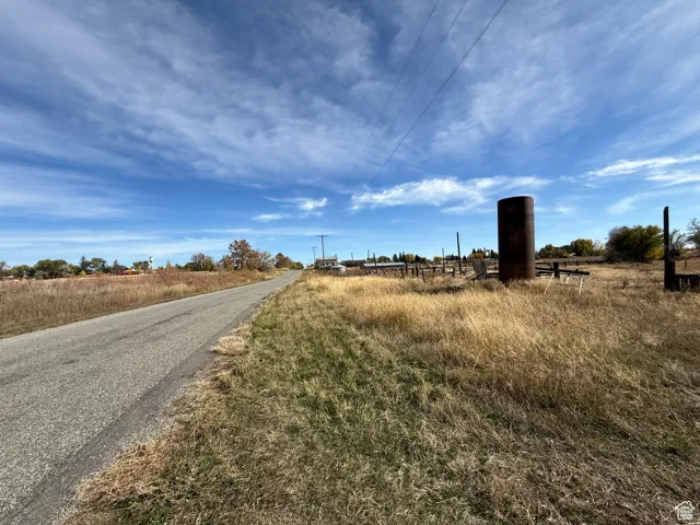 View of asphalt road with a view of countryside