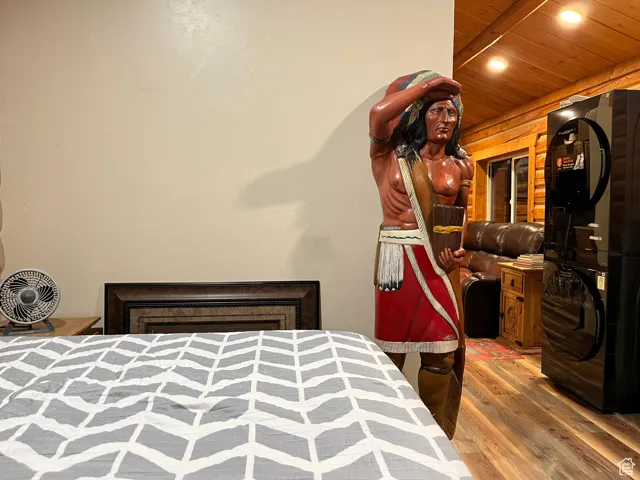 Bedroom featuring wood finished floors, recessed lighting, and wooden ceiling