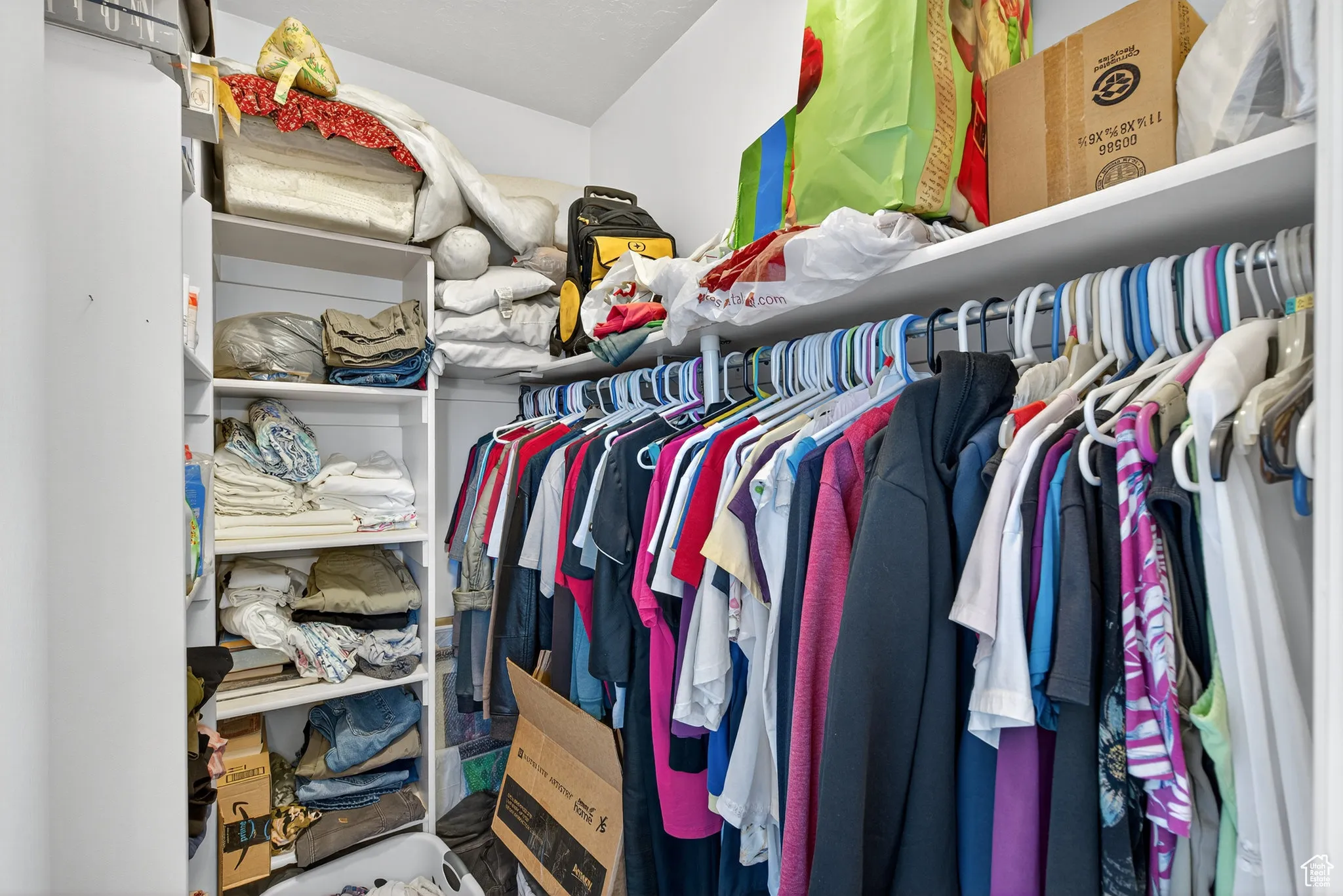 Primary bedroom walk in closet.