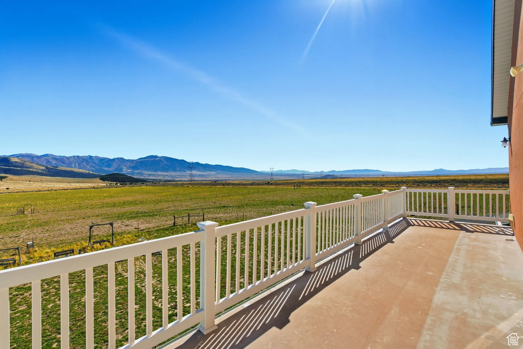 East side second floor balcony featuring a mountain view and a view of rural area.
