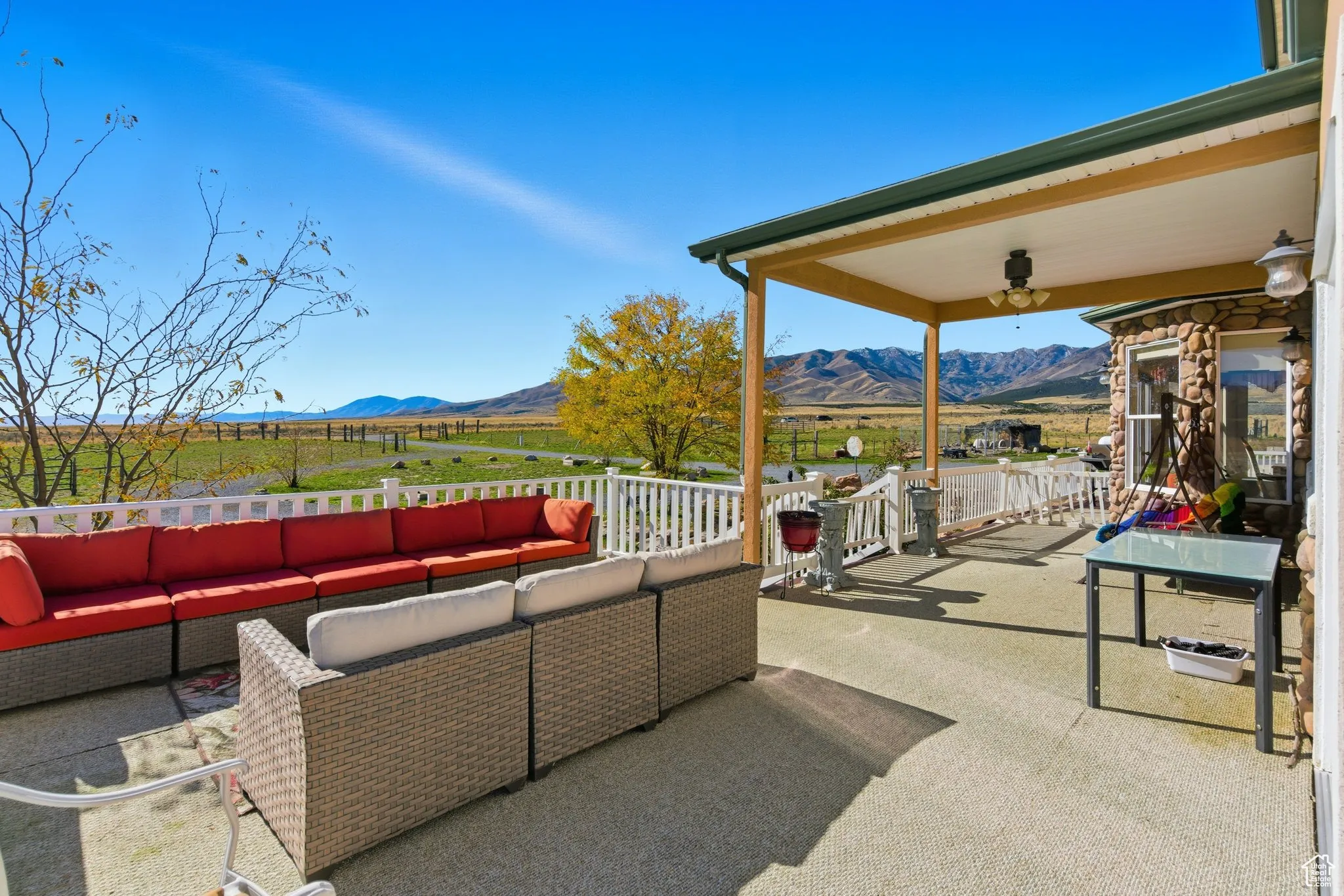 View of  deck and porch featuring a mountain view, an outdoor living space.