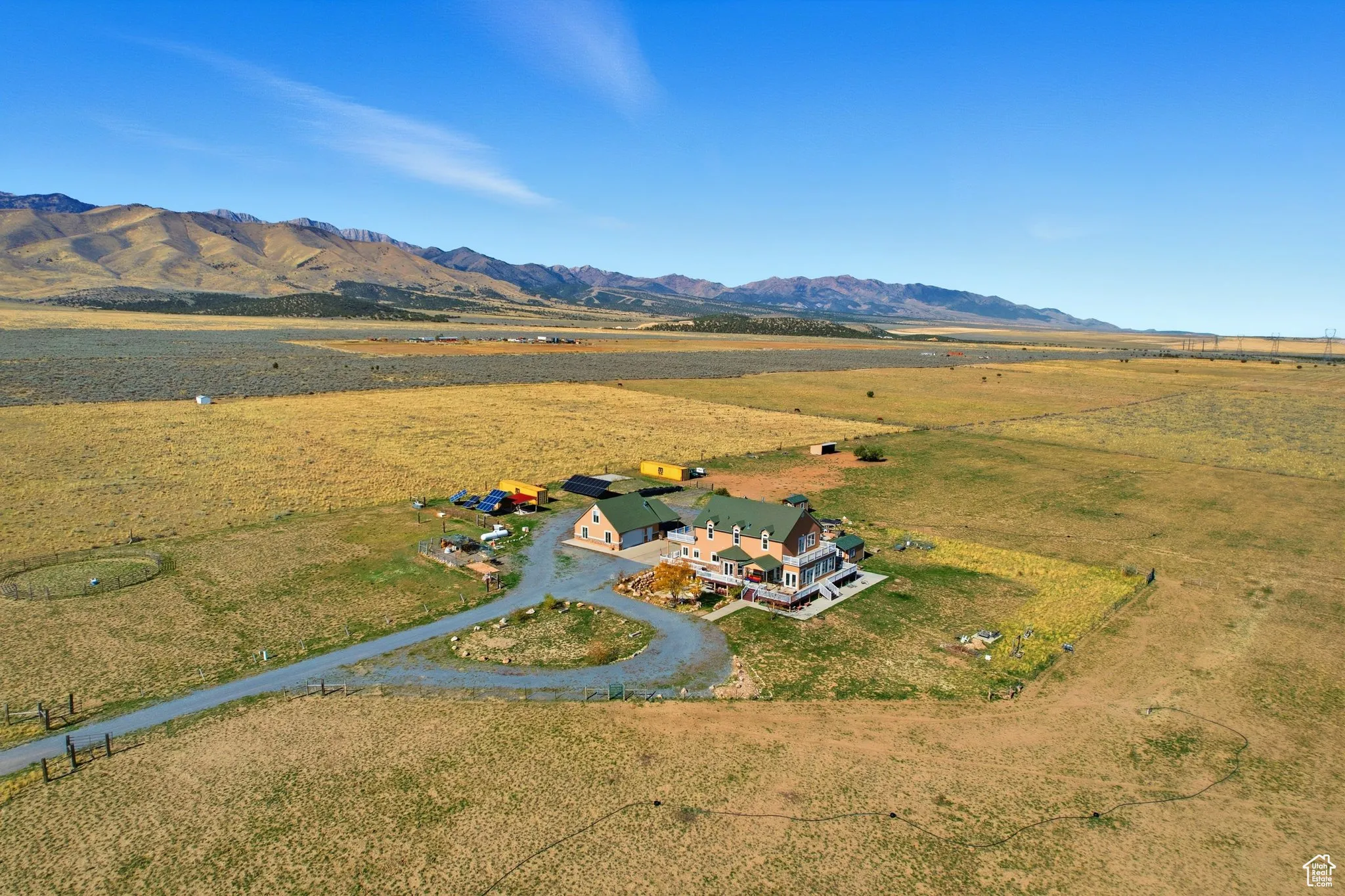 Aerial view of home featuring mountains, north west.