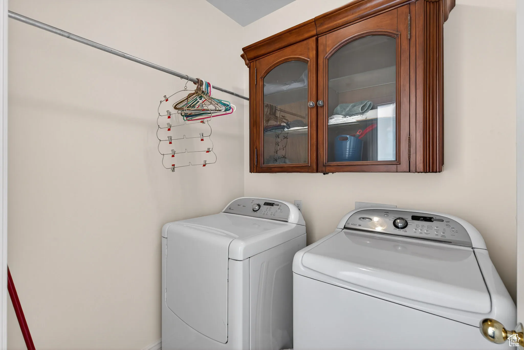 Second floor laundry area featuring washer and clothes dryer.