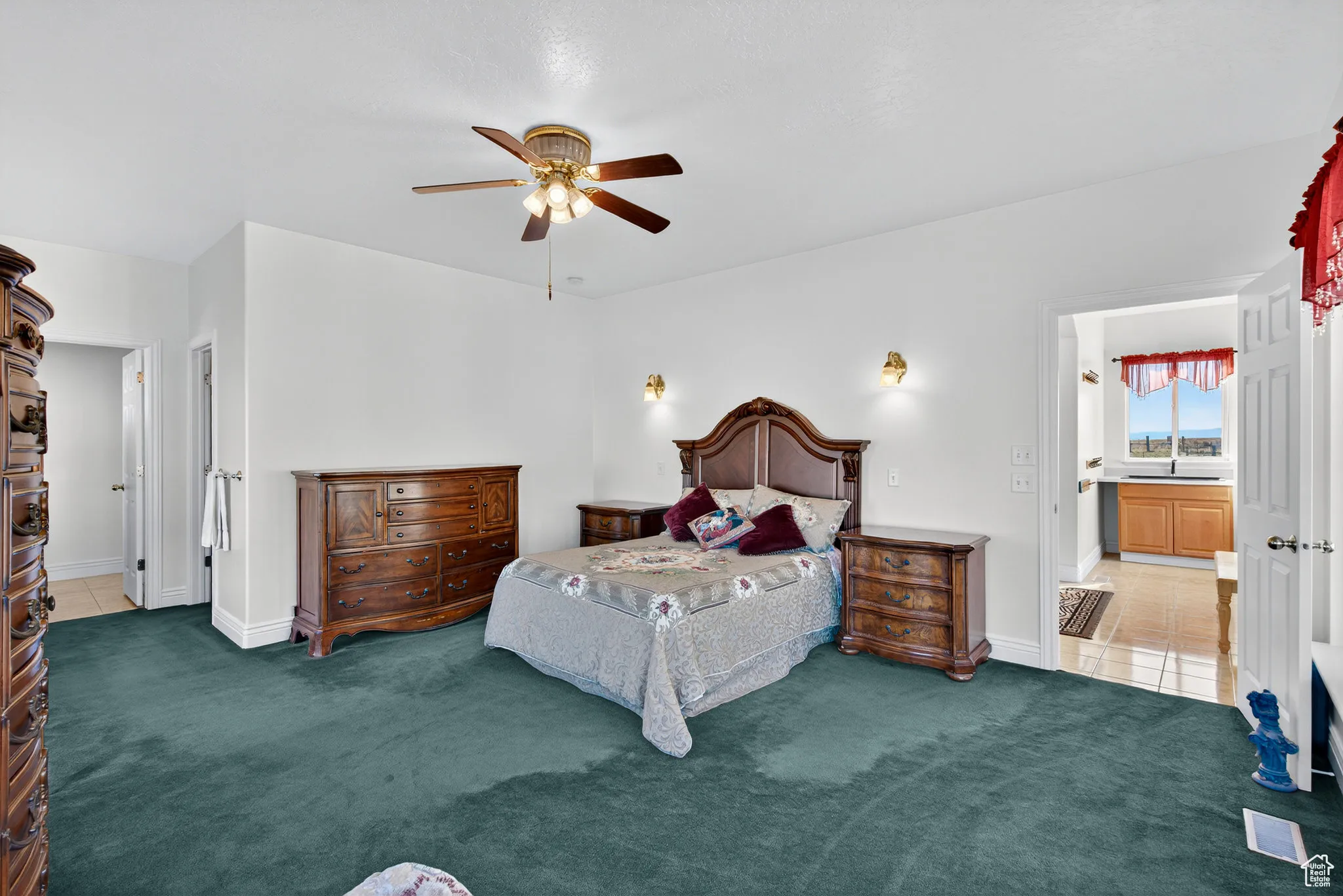 Carpeted  primary bedroom just off the entry way and kitchen.