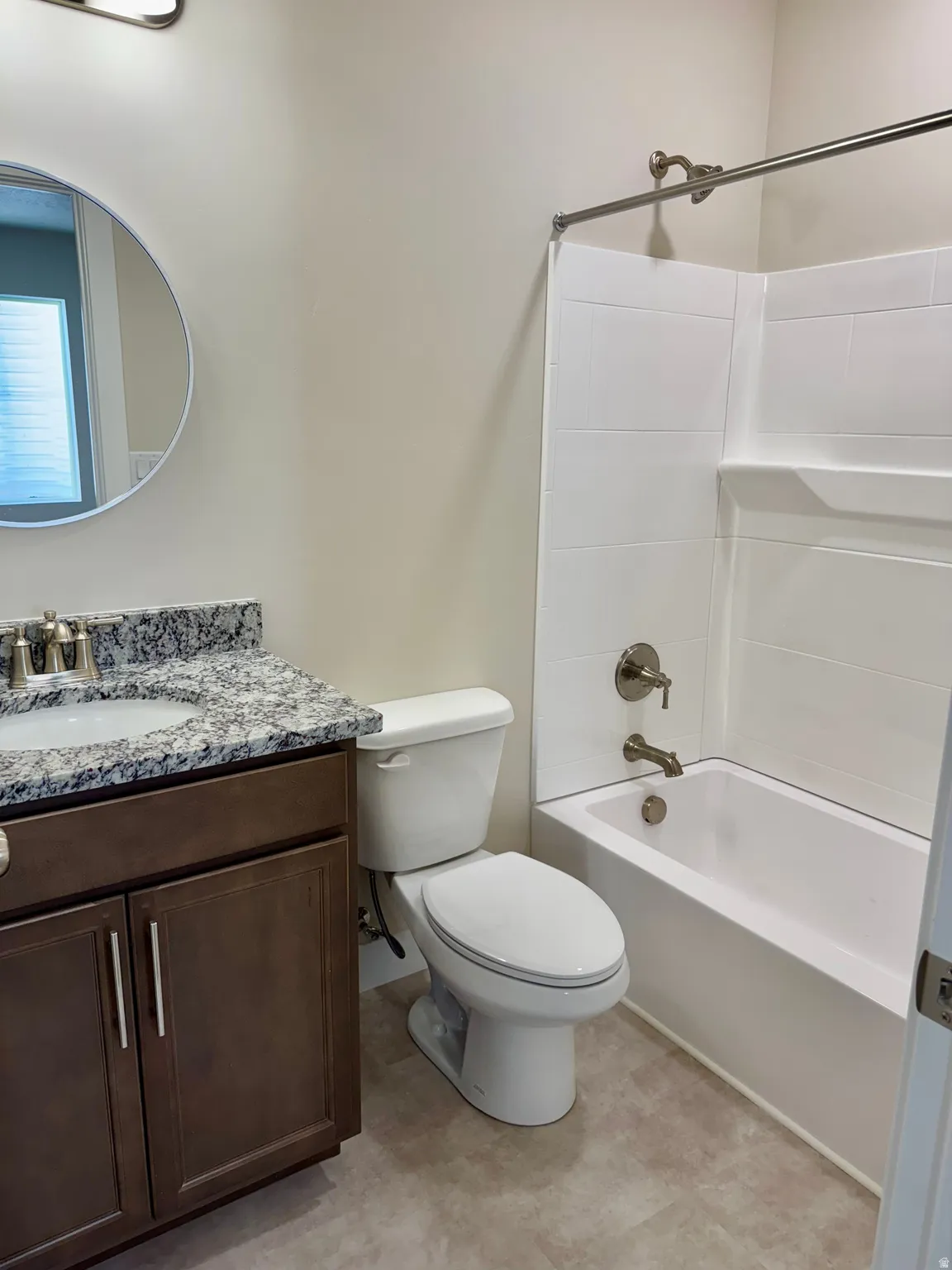 Full bath featuring tub / shower combination and vanity