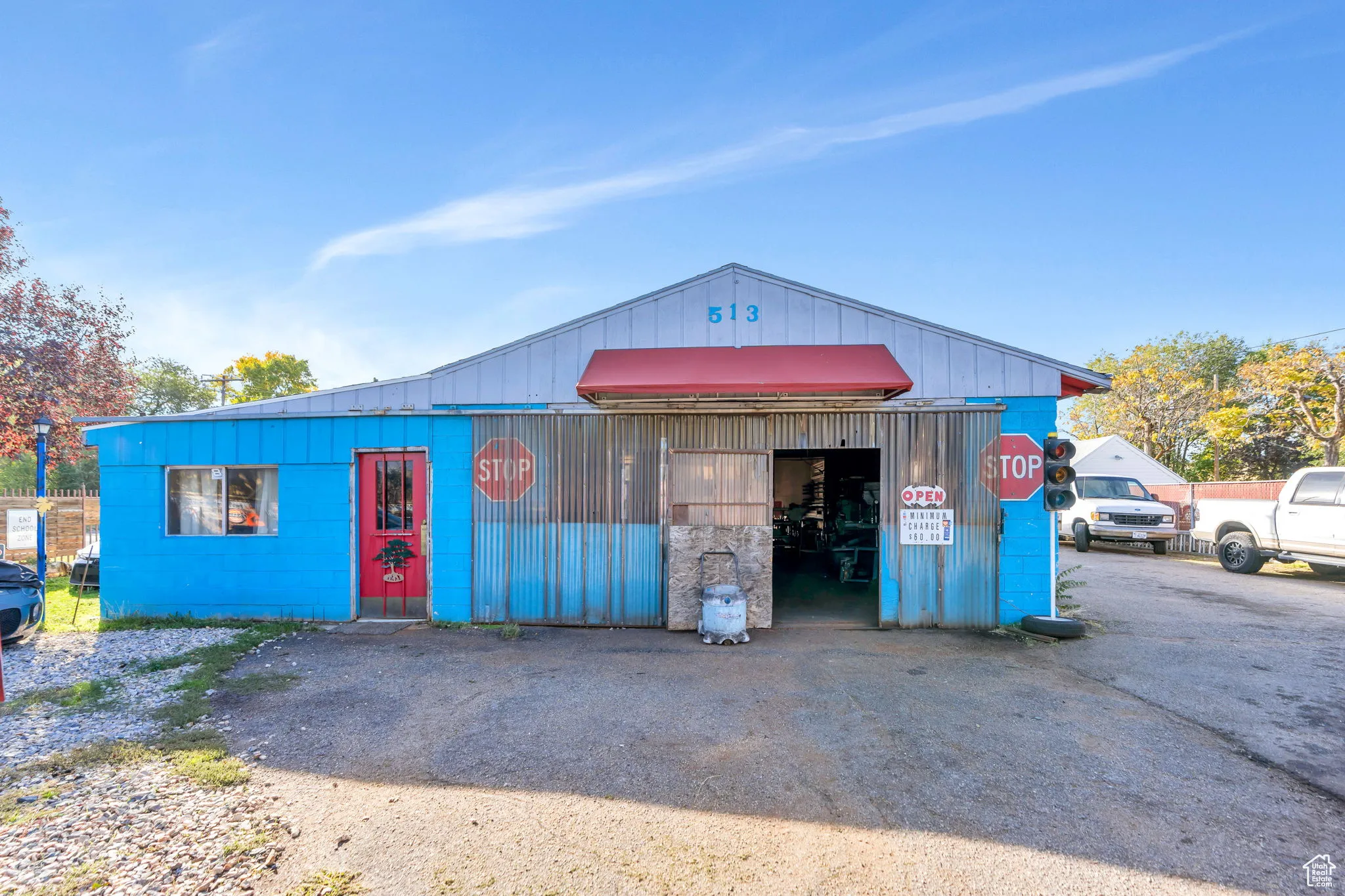 View of building exterior with an outbuilding