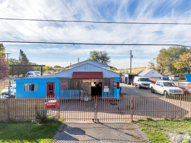Bungalow-style home featuring a fenced front yard