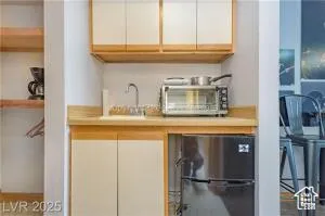 Kitchen with light countertops and white cabinets