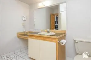Bathroom featuring vanity and light tile patterned floors