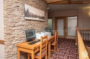 Dining space featuring an office area and french doors