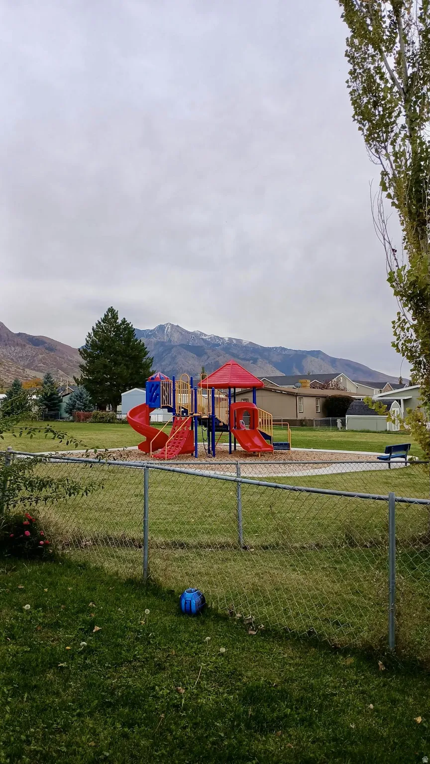 Community playground featuring a mountain view