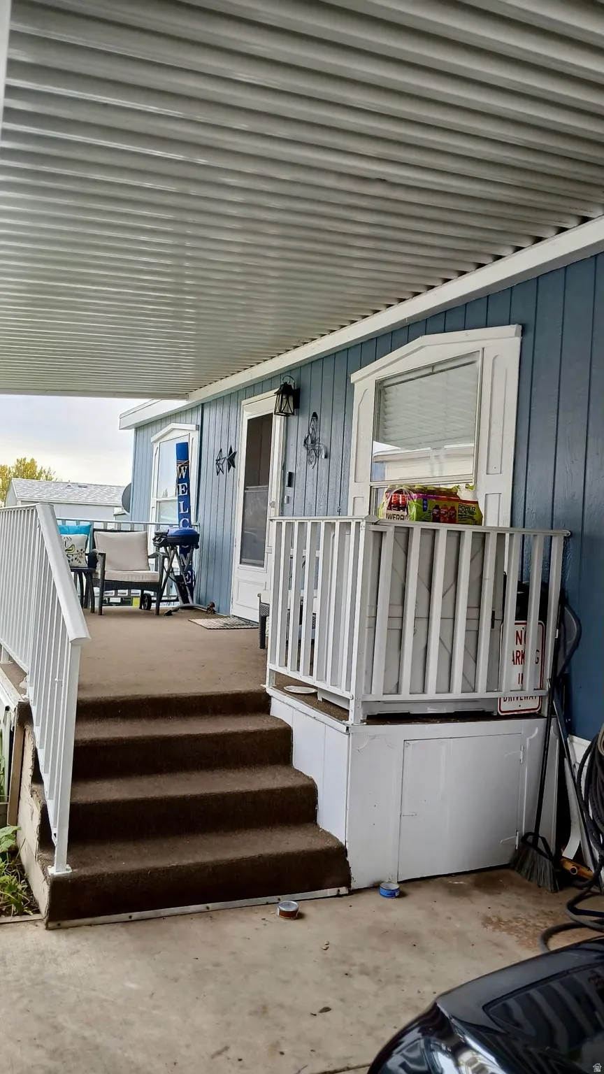 Entrance to property featuring a deck