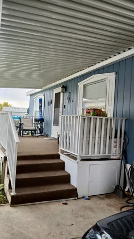 Entrance to property featuring a deck