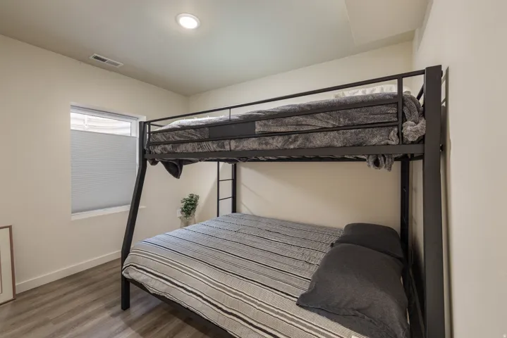 Bedroom featuring wood finished floors and recessed lighting