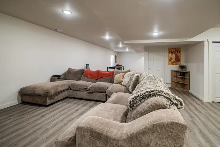 Living area featuring light wood-style floors and recessed lighting
