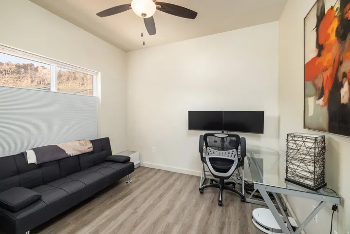 Office area featuring wood finished floors and a ceiling fan