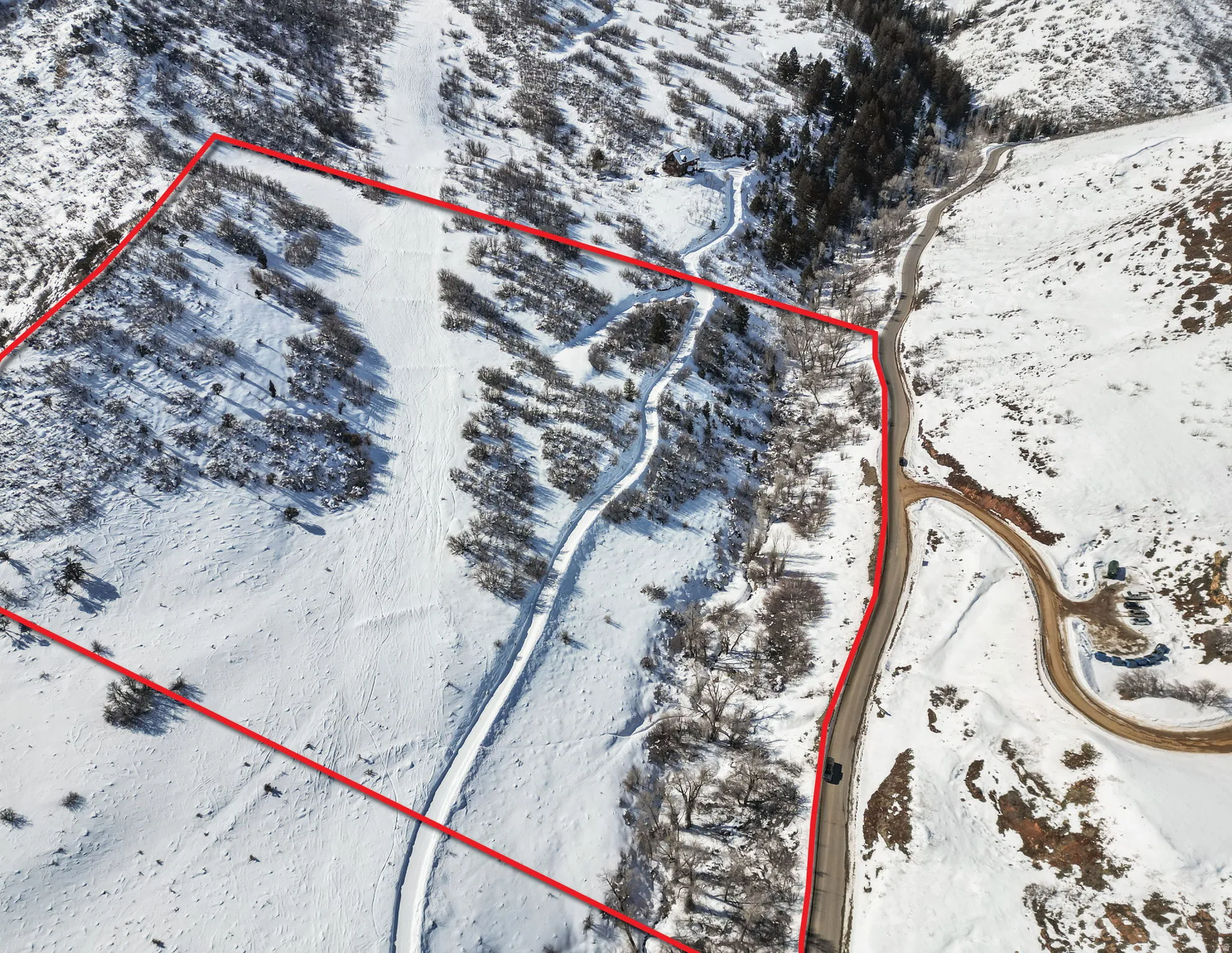 Snowy aerial view featuring property boundaries highlighted