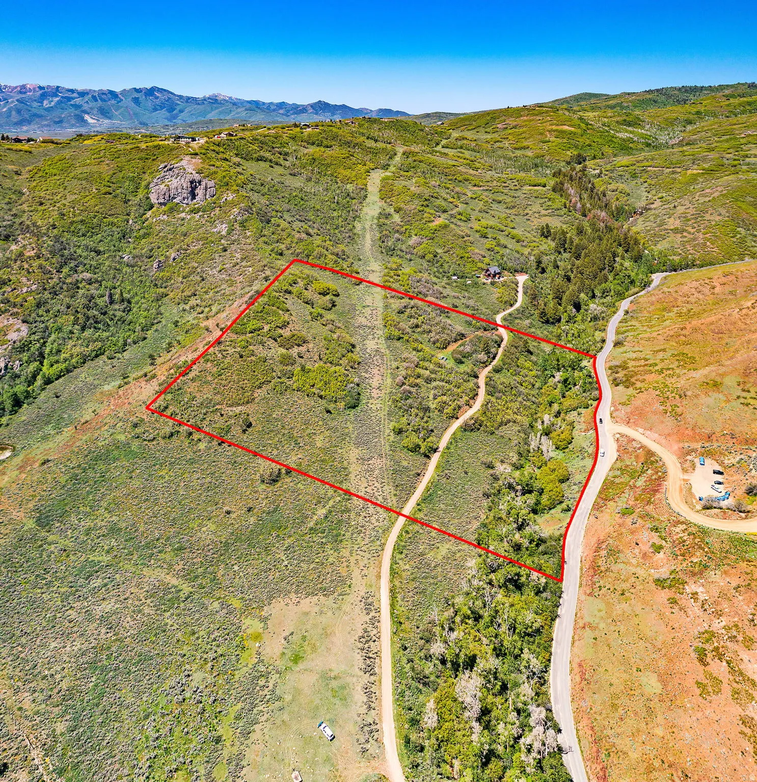 View of rural area featuring property parcel outlined and mountains