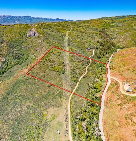 View of rural area featuring property parcel outlined and mountains