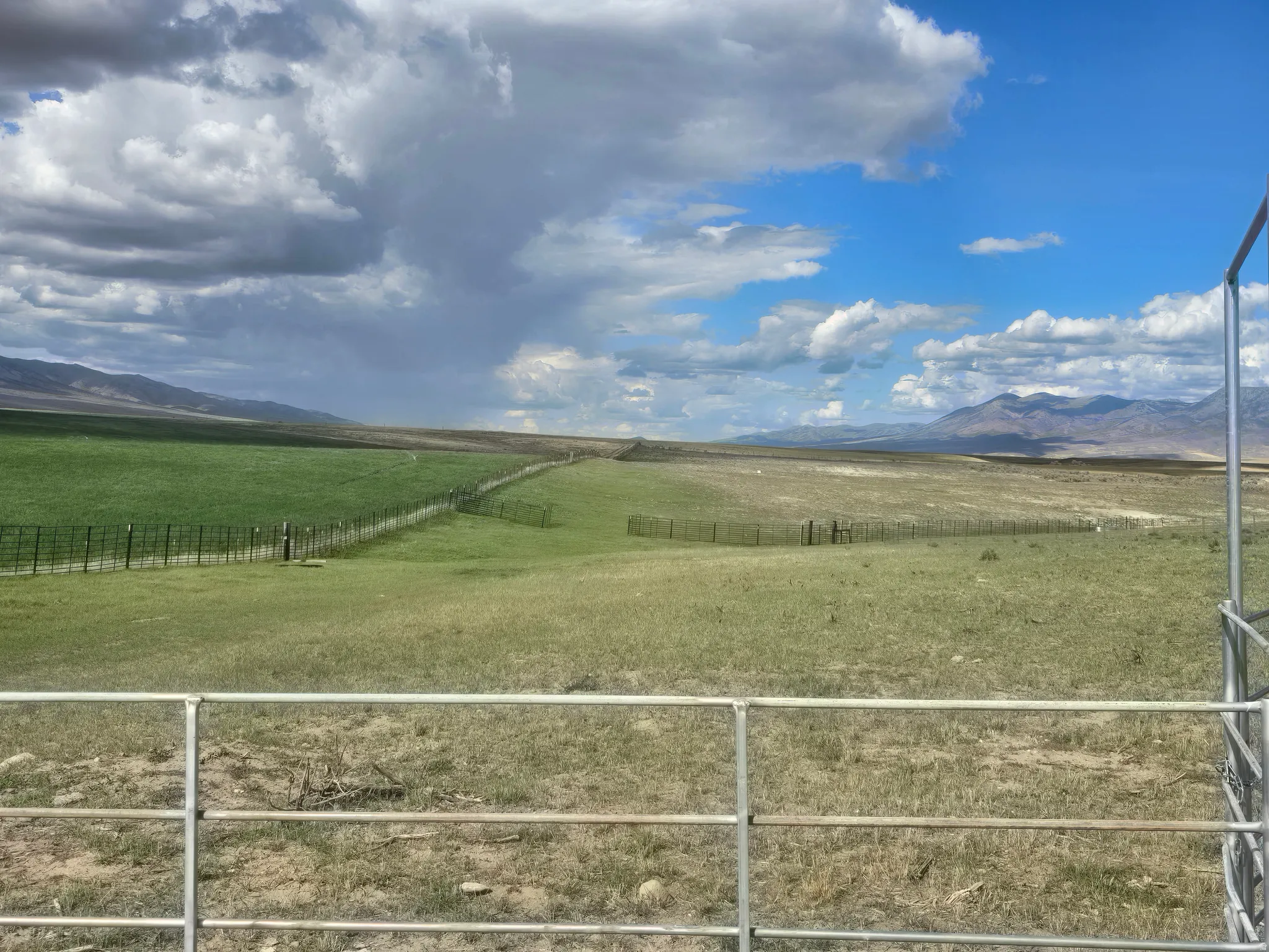View of mountain backdrop with rural landscape and a pastoral area