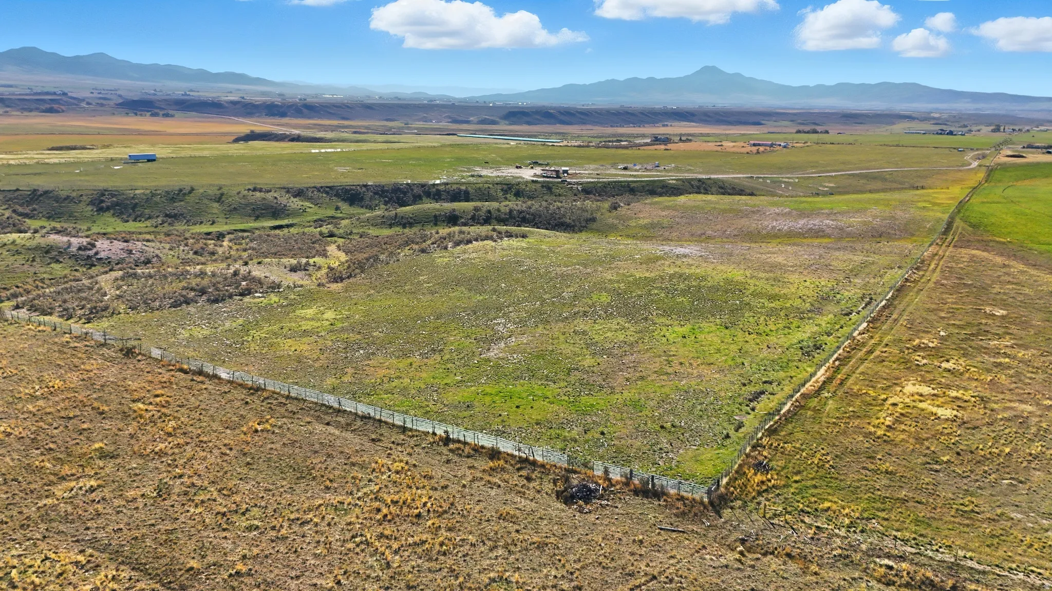 Overview of rural landscape with a mountain backdrop