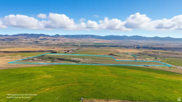 View of rural area with a mountainous background and property parcel outlined