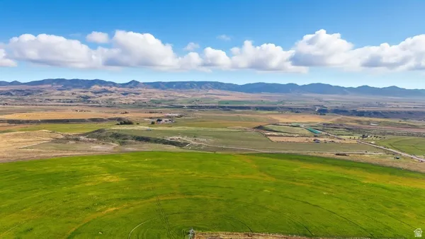 View of mountain backdrop featuring rural landscape