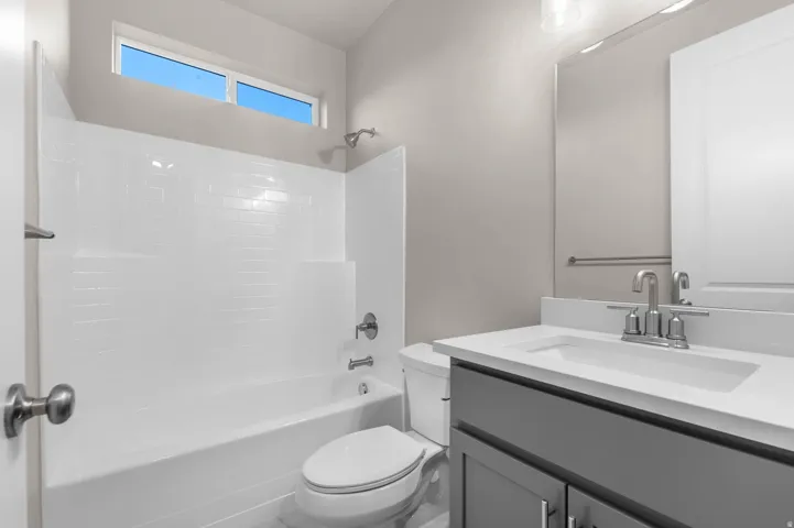Bathroom featuring shower / bath combination and vanity