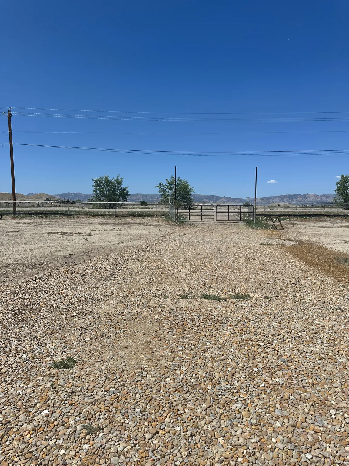 View of yard featuring a view of rural / pastoral area and a mountain view
