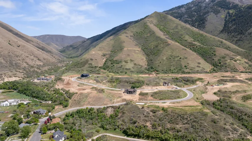Sweeping mountain valley with newly paved roads and developed residential lots