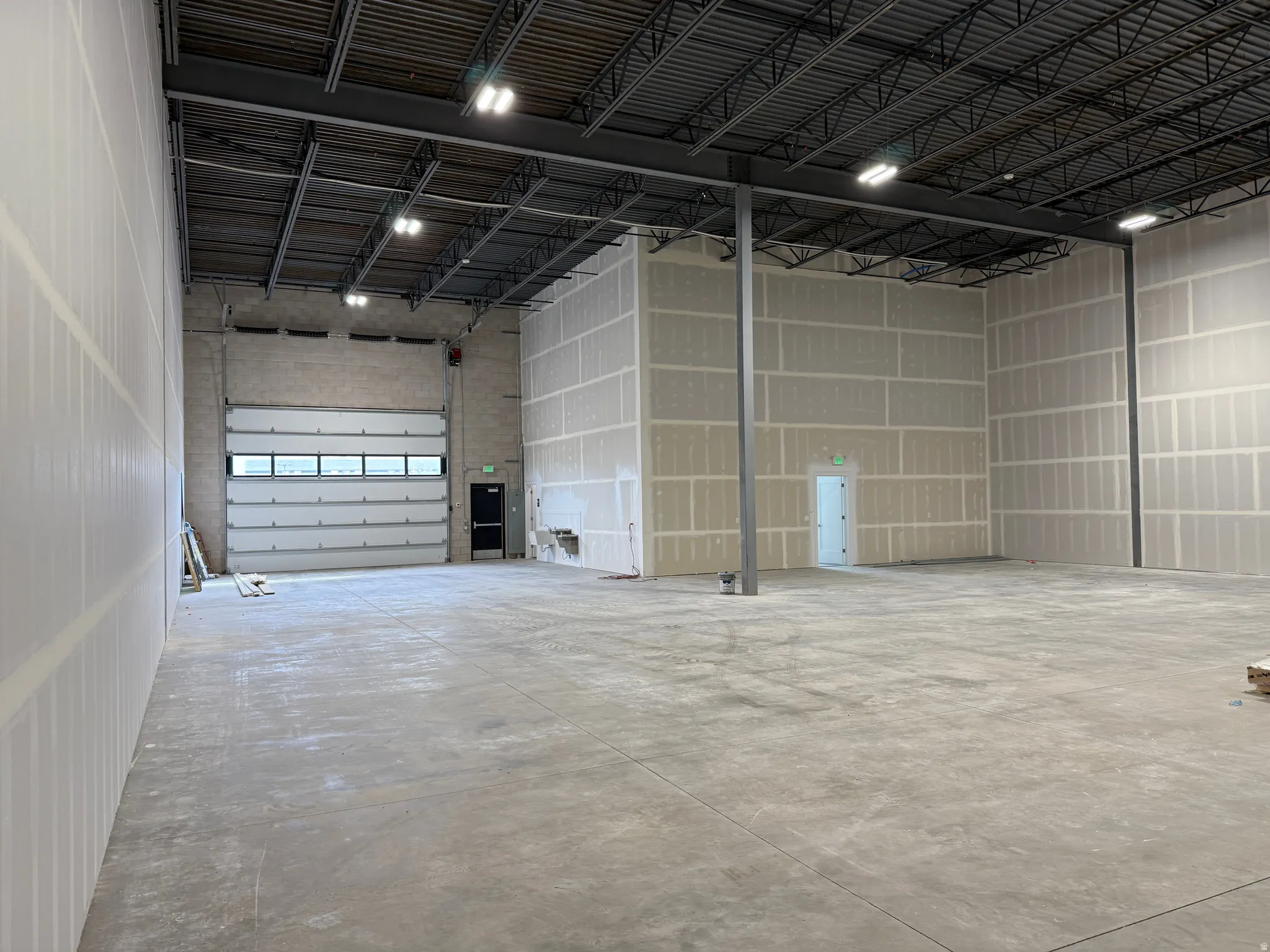 Garage featuring metal wall