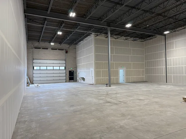 Garage featuring metal wall