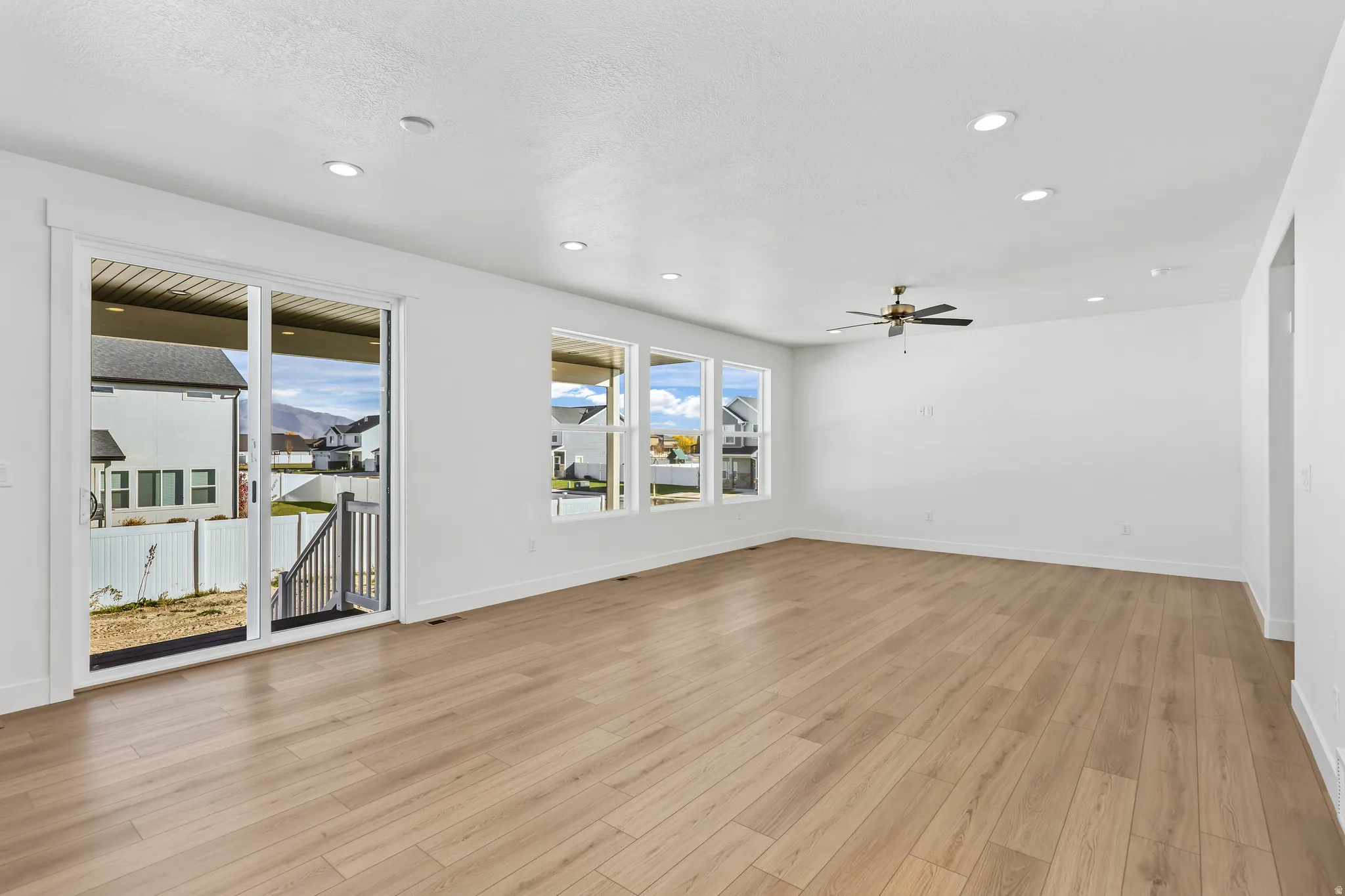 Spare room with recessed lighting, light wood-style flooring, and a ceiling fan