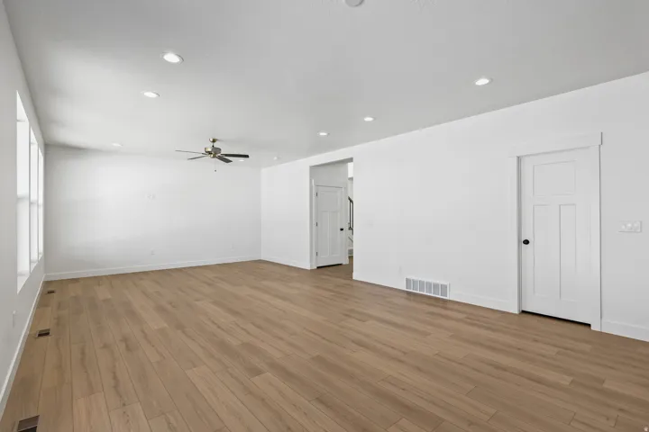 Spare room featuring recessed lighting, light wood-type flooring, and a ceiling fan