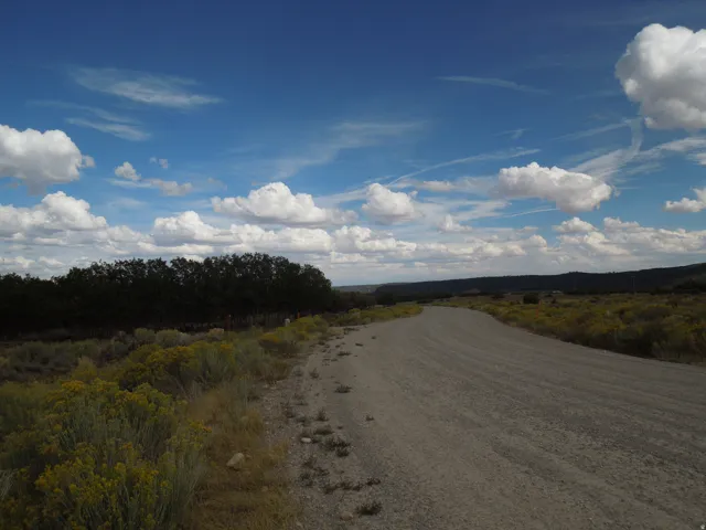 View of dirt / gravel road with a view of countryside