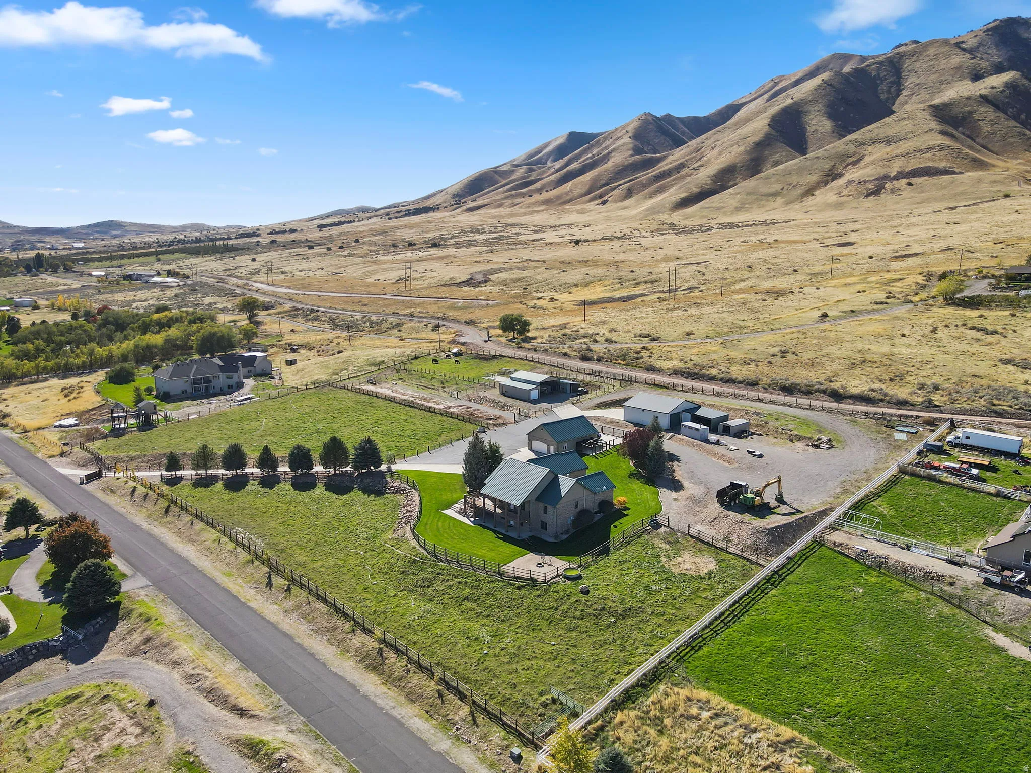 Aerial view of this 5.02 Acre property's location with a mountainous background.
